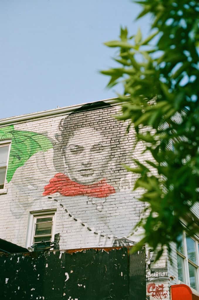 Sophia lauren mural in little italy photographed during a film engagement session 