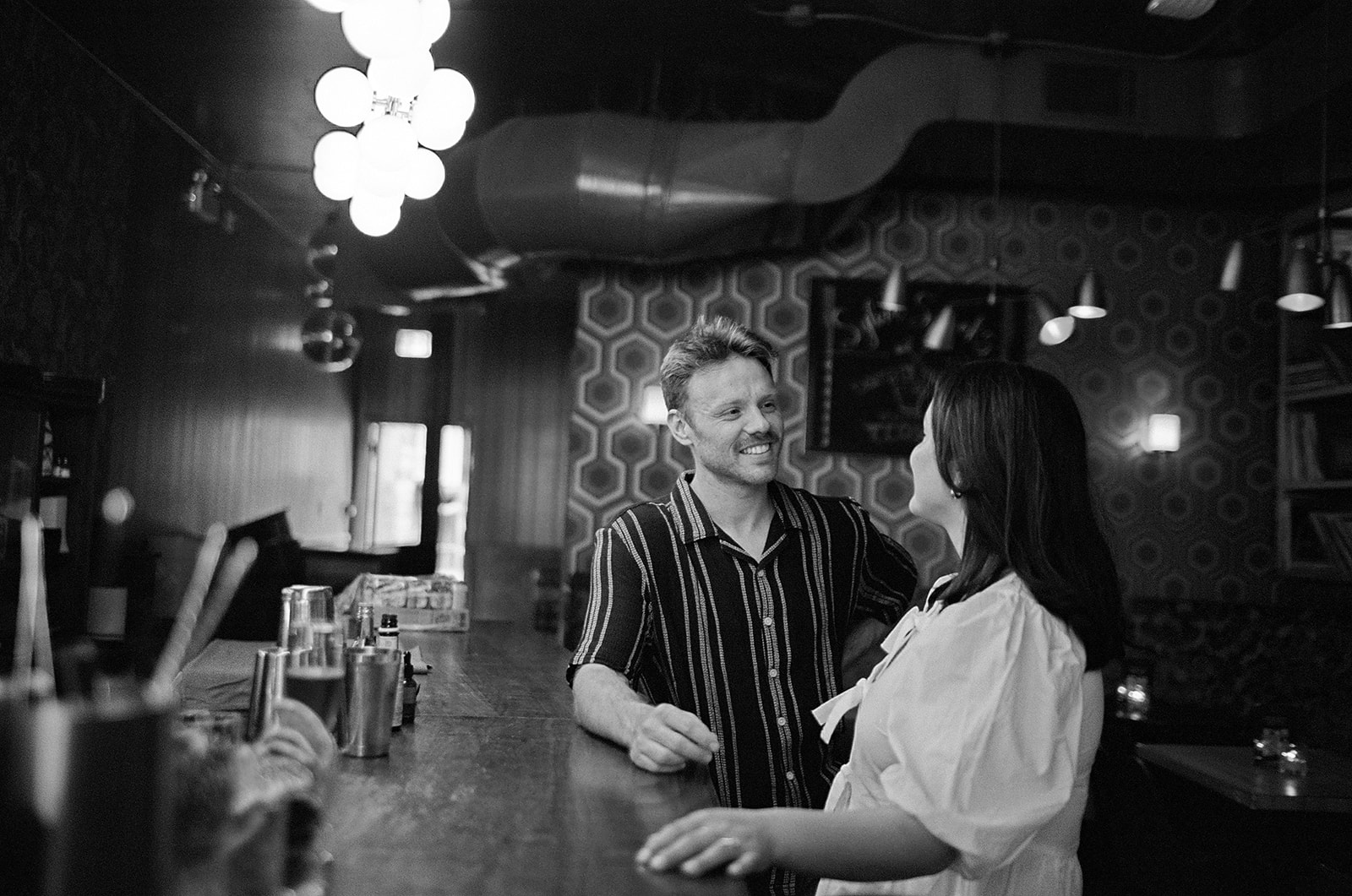 Natural moment captured on 35mm film during Toronto Mrs Robinson's bar engagement shoot