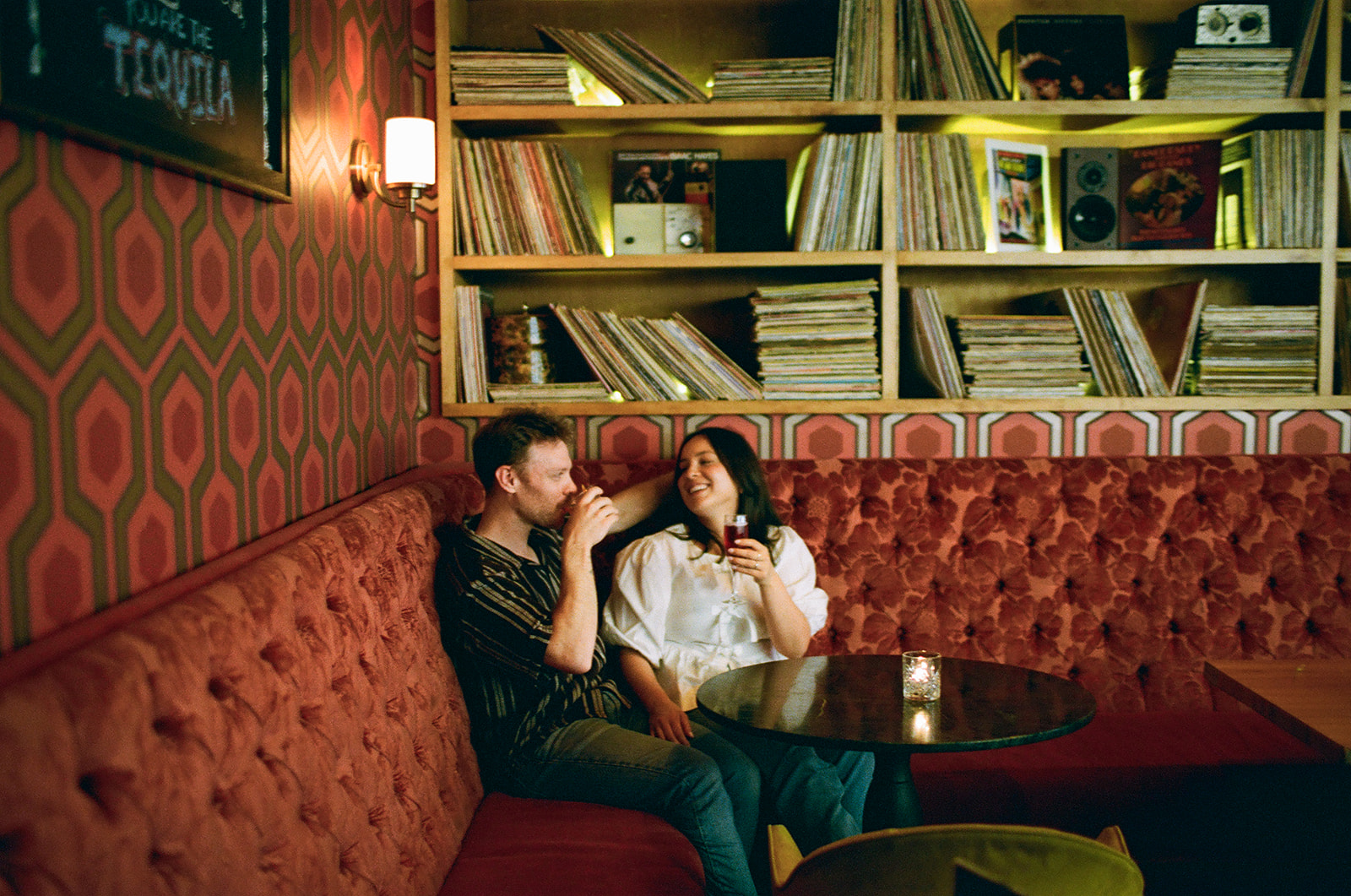 Candid engagement photo in Toronto’s Little Italy taken on film camera