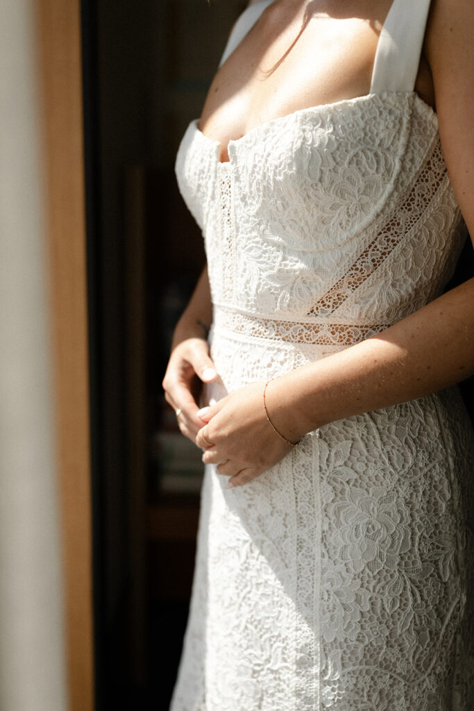 Bride gazing out the window at the Drake hotel before wedding in Toronto